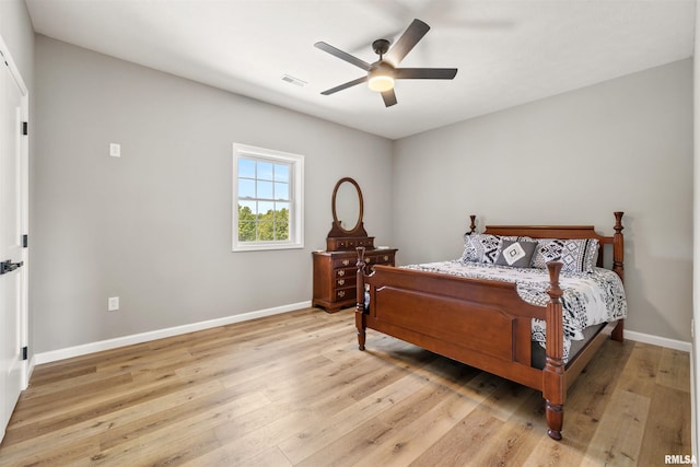 142 Oak Rd, Harrisburg, IL 62946 - bedroom with light wood finished floors, baseboards, and a ceiling fan