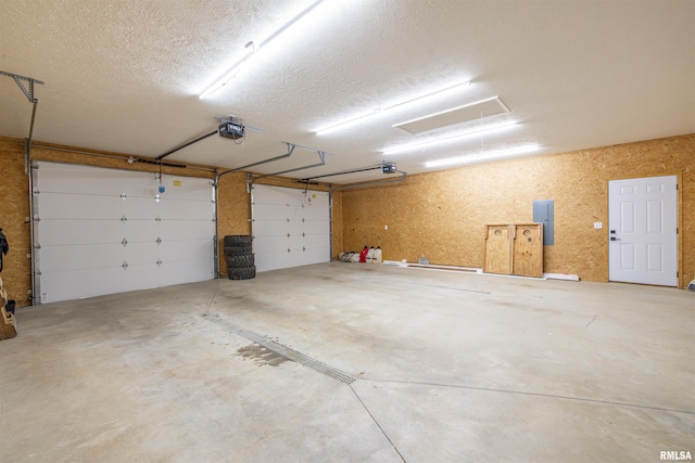 142 Oak Rd, Harrisburg, IL 62946 - garage featuring a garage door opener and electric panel
