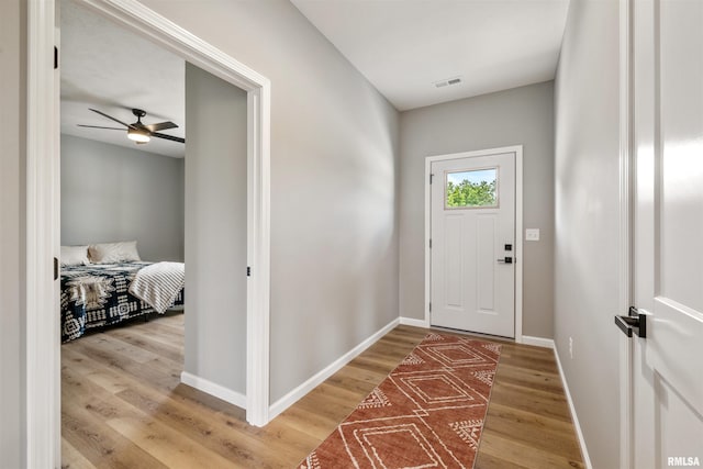 142 Oak Rd, Harrisburg, IL 62946 - foyer featuring light wood-style flooring, baseboards, and ceiling fan