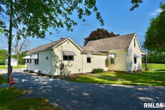 7059 Midway Rd, Metropolis, IL 62960 - back of property with a lawn and an outbuilding