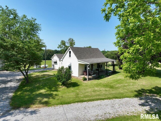 7059 Midway Rd, Metropolis, IL 62960 - view of side of property with a porch, a lawn, and a shingled roof