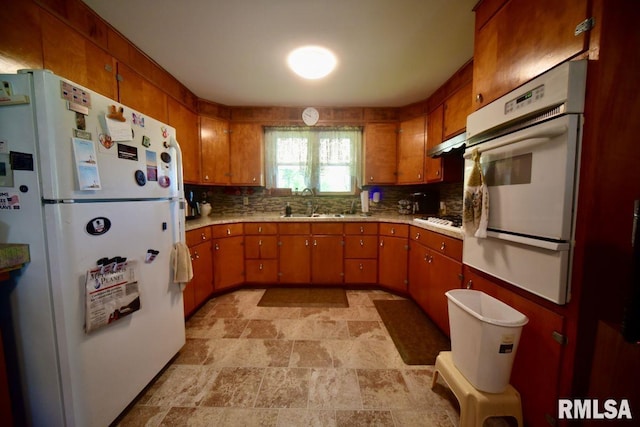 7059 Midway Rd, Metropolis, IL 62960 - kitchen with white appliances, stone finish flooring, light countertops, and decorative backsplash
