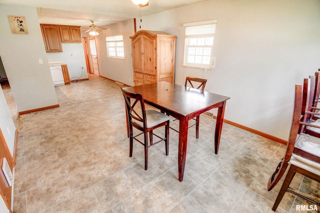 206 W N St, Assumption, IL 62510 - dining room featuring healthy amount of natural light, a ceiling fan, and baseboards