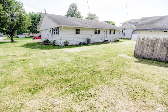 206 W N St, Assumption, IL 62510 - rear view of house with a yard and central air condition unit