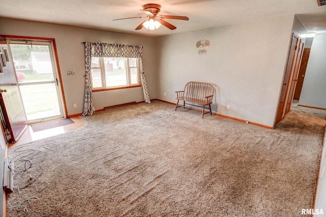 206 W N St, Assumption, IL 62510 - empty room featuring a ceiling fan, carpet, and baseboards