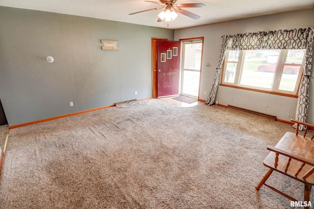 206 W N St, Assumption, IL 62510 - carpeted empty room with a ceiling fan and baseboards