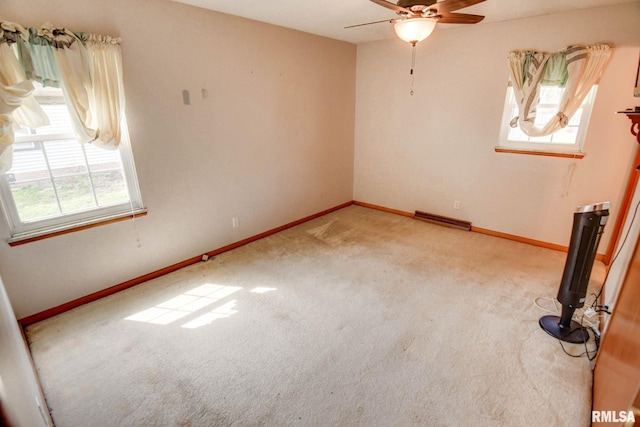 206 W N St, Assumption, IL 62510 - spare room featuring a ceiling fan, carpet floors, and baseboards