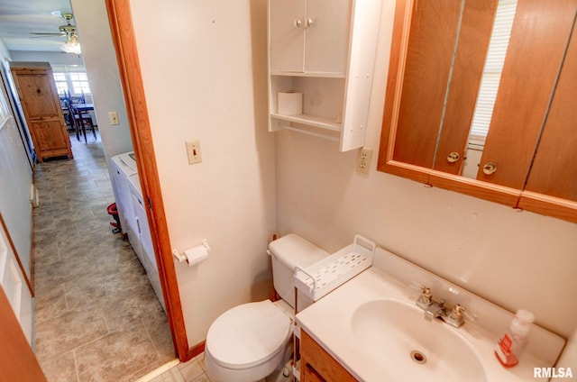 206 W N St, Assumption, IL 62510 - bathroom featuring a ceiling fan, toilet, and vanity