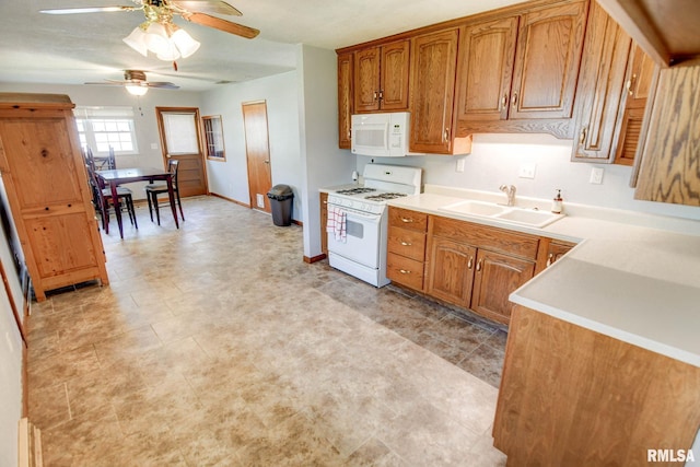 206 W N St, Assumption, IL 62510 - kitchen with white appliances, a sink, a ceiling fan, brown cabinets, and light countertops