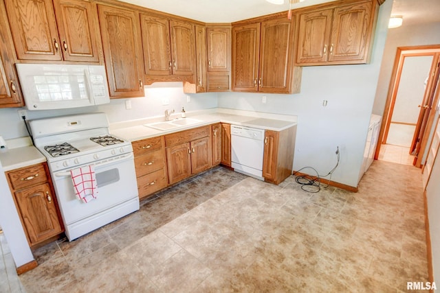 206 W N St, Assumption, IL 62510 - kitchen with white appliances, a sink, brown cabinetry, and light countertops