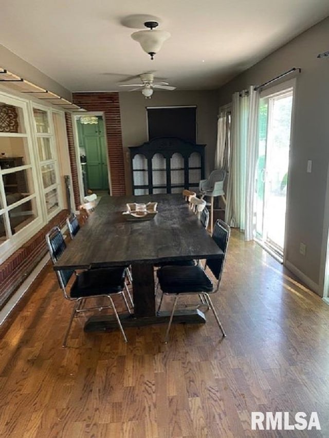 413 W Grant St, Pittsfield, IL 62363 - dining room featuring a ceiling fan, wood finished floors, and baseboards
