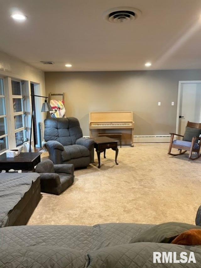 413 W Grant St, Pittsfield, IL 62363 - carpeted living room featuring recessed lighting, a baseboard radiator, and baseboards