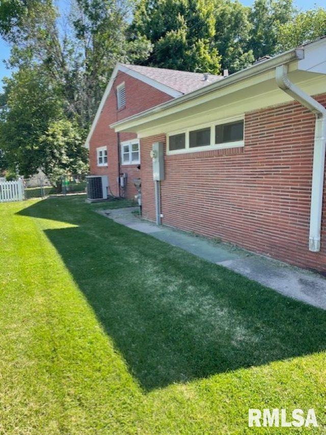 413 W Grant St, Pittsfield, IL 62363 - view of side of home featuring central AC and brick siding