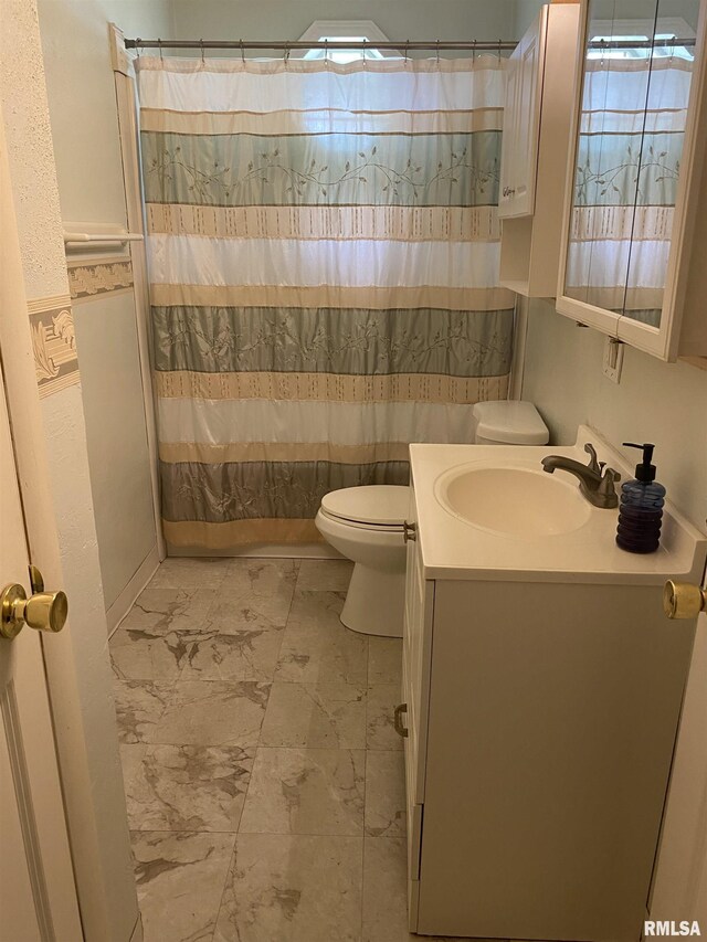 107 Locust Rd, Meredosia, IL 62665 - bathroom featuring marble finish flooring, toilet, and vanity