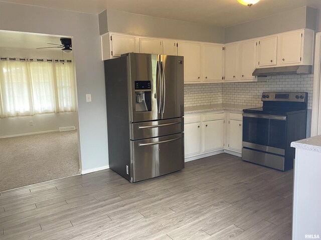 107 Locust Rd, Meredosia, IL 62665 - kitchen featuring stainless steel appliances, under cabinet range hood, light countertops, and a ceiling fan