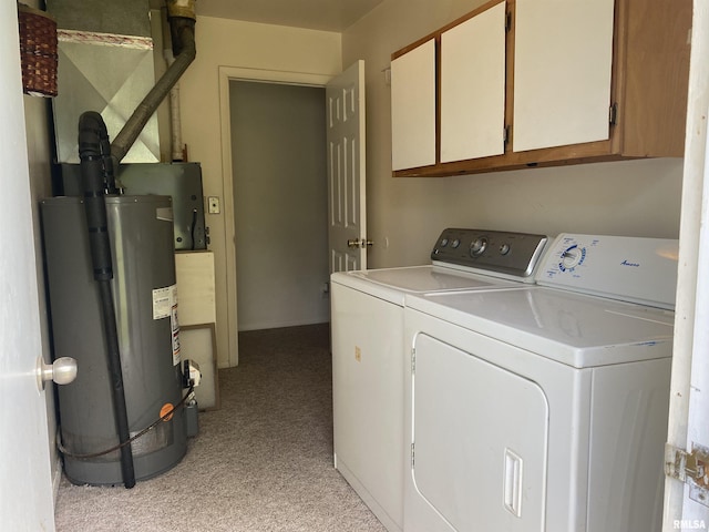 107 Locust Rd, Meredosia, IL 62665 - clothes washing area featuring washer and dryer, water heater, cabinet space, and light carpet