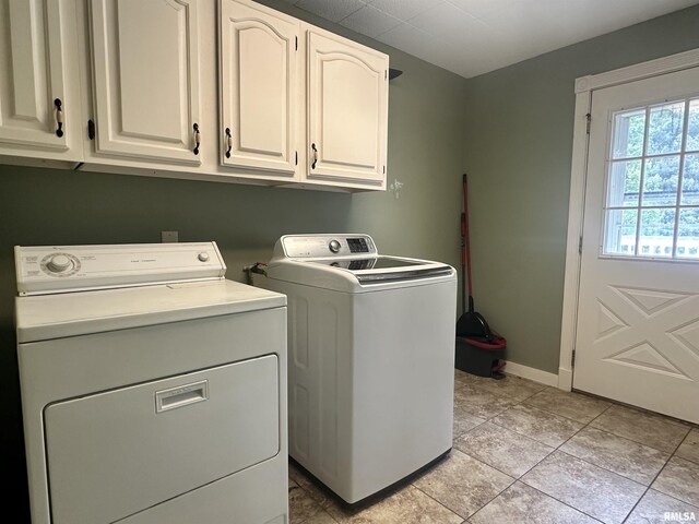 335 E S St, Mendon, IL 62351 - laundry area featuring separate washer and dryer, cabinet space, baseboards, and light tile patterned flooring