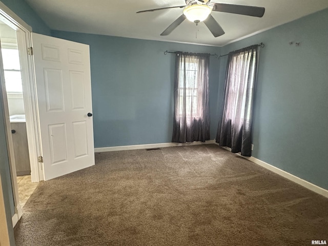 335 E S St, Mendon, IL 62351 - empty room featuring carpet floors, a ceiling fan, and baseboards