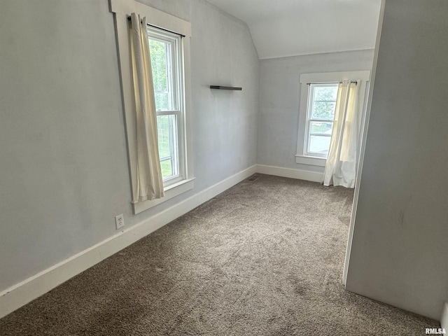 335 E S St, Mendon, IL 62351 - carpeted spare room with vaulted ceiling and baseboards