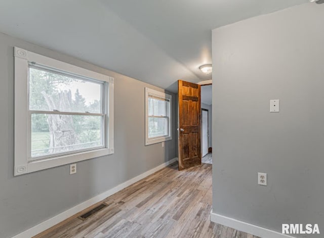 1507 4th St, Lincoln, IL 62656 - empty room featuring baseboards and light wood-type flooring