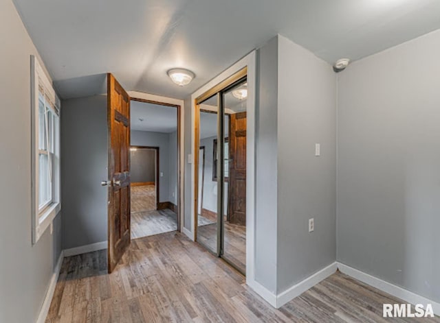 1507 4th St, Lincoln, IL 62656 - hall with light wood-style flooring and baseboards