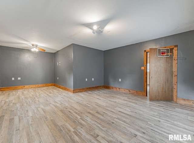 1507 4th St, Lincoln, IL 62656 - spare room featuring wood finished floors, ceiling fan, and baseboards