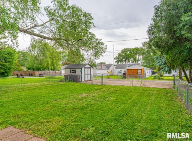 1507 4th St, Lincoln, IL 62656 - view of yard with a shed and an outbuilding