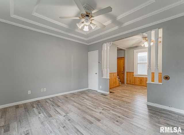 1507 4th St, Lincoln, IL 62656 - unfurnished room featuring a ceiling fan, wood finished floors, a tray ceiling, crown molding, and wainscoting