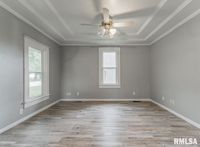 1507 4th St, Lincoln, IL 62656 - spare room with a tray ceiling, a ceiling fan, wood finished floors, and crown molding
