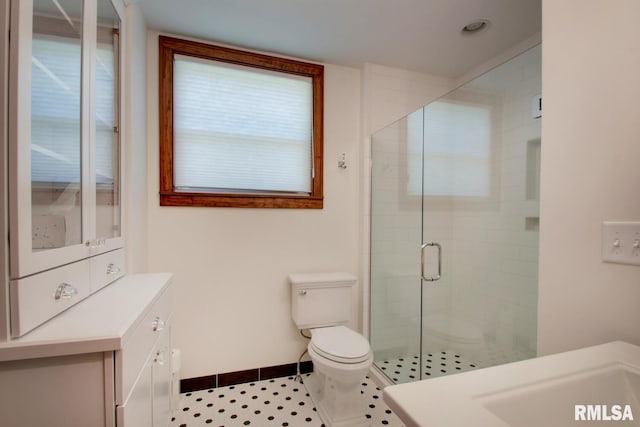 321 S 23rd St, Quincy, IL 62301 - full bath with a shower stall, baseboards, toilet, and vanity