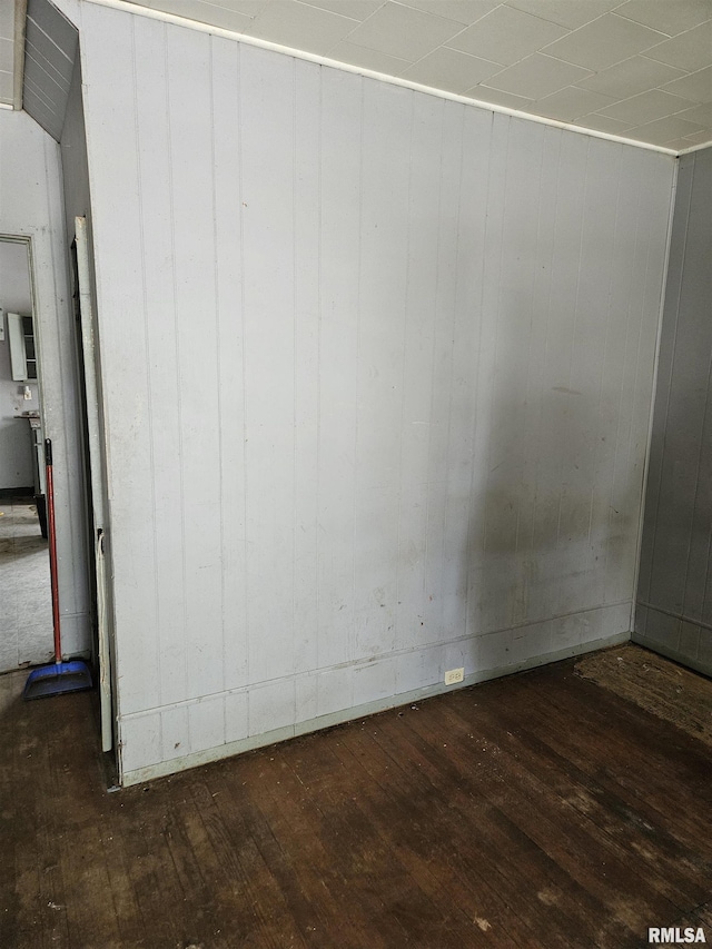 212 Chestnut St, Quincy, IL 62301 - unfurnished room featuring hardwood / wood-style floors and wood walls