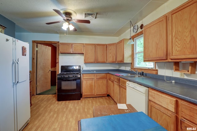 305 E Clay St, Pleasant Hill, IL 62366 - kitchen featuring white appliances, a sink, dark countertops, light wood-style floors, and ceiling fan