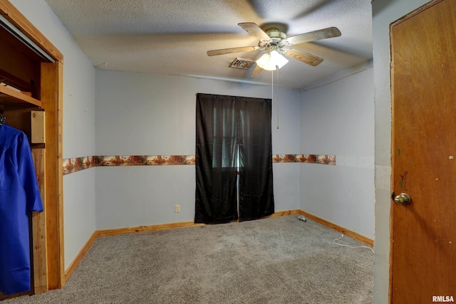305 E Clay St, Pleasant Hill, IL 62366 - carpeted empty room featuring ceiling fan, baseboards, and a textured ceiling