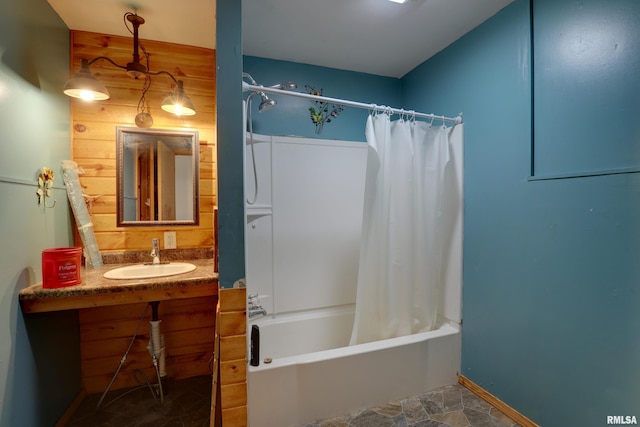 305 E Clay St, Pleasant Hill, IL 62366 - bathroom featuring a sink, shower / bath combo with shower curtain, and baseboards