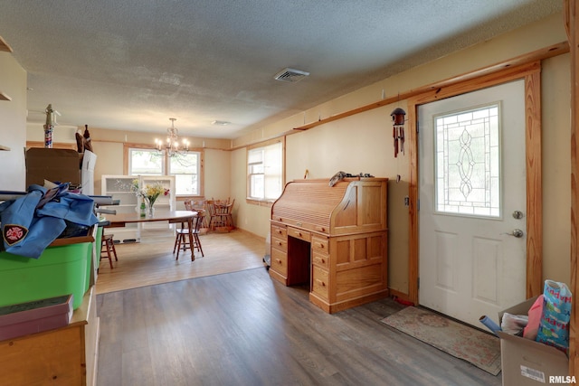 305 E Clay St, Pleasant Hill, IL 62366 - entryway featuring a chandelier, wood finished floors, a textured ceiling, and baseboards