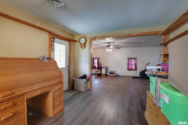 305 E Clay St, Pleasant Hill, IL 62366 - office featuring dark wood-style flooring, a ceiling fan, and a textured ceiling