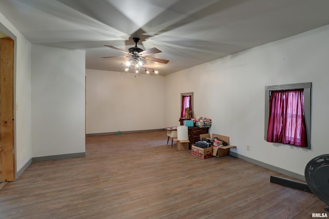 305 E Clay St, Pleasant Hill, IL 62366 - unfurnished room with a ceiling fan, wood finished floors, and baseboards