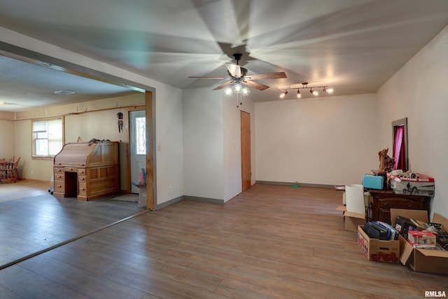 305 E Clay St, Pleasant Hill, IL 62366 - interior space featuring a ceiling fan, wood finished floors, and baseboards