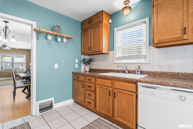 1622 W Cook St, Springfield, IL 62704 - kitchen featuring dishwasher, a sink, dark countertops, and tasteful backsplash
