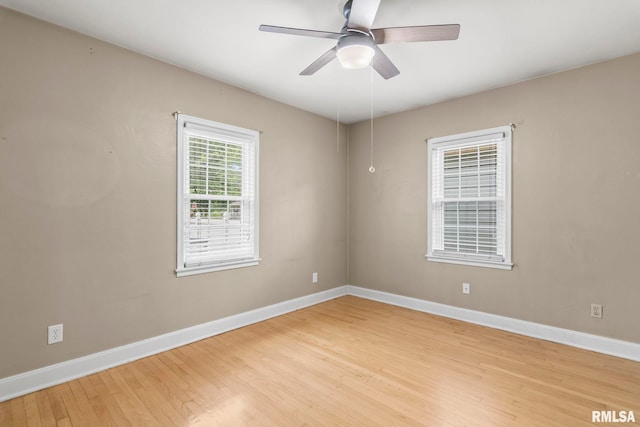 1622 W Cook St, Springfield, IL 62704 - empty room with baseboards, light wood finished floors, and a ceiling fan