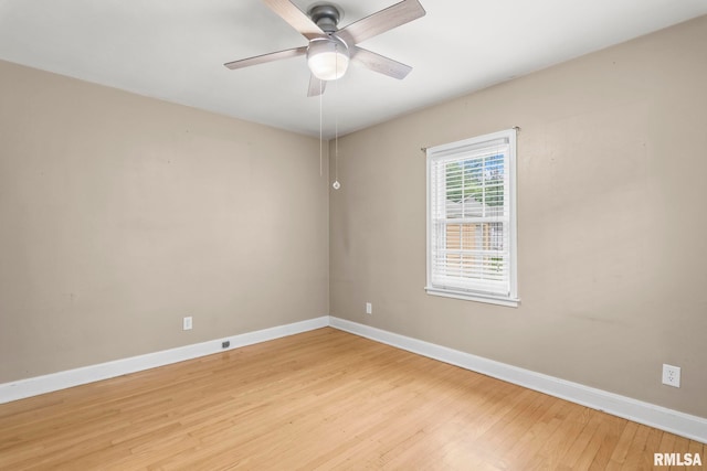 1622 W Cook St, Springfield, IL 62704 - unfurnished room with baseboards, light wood-style floors, and ceiling fan
