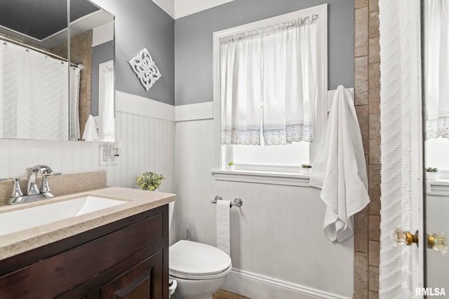 1622 W Cook St, Springfield, IL 62704 - full bath with toilet, vanity, and a wainscoted wall