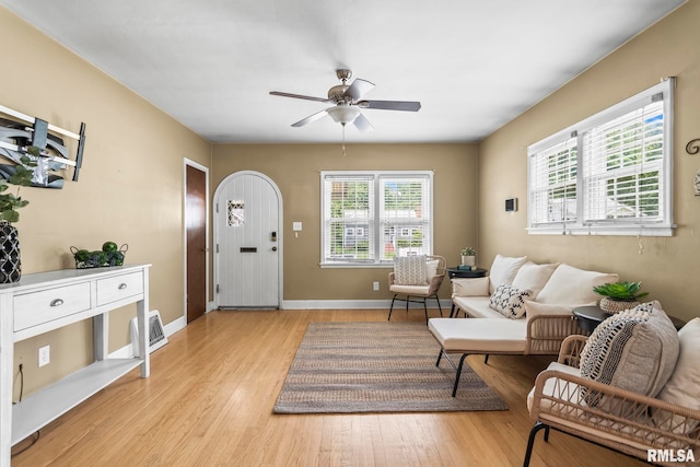 1622 W Cook St, Springfield, IL 62704 - living room featuring ceiling fan, light wood-style flooring, and baseboards