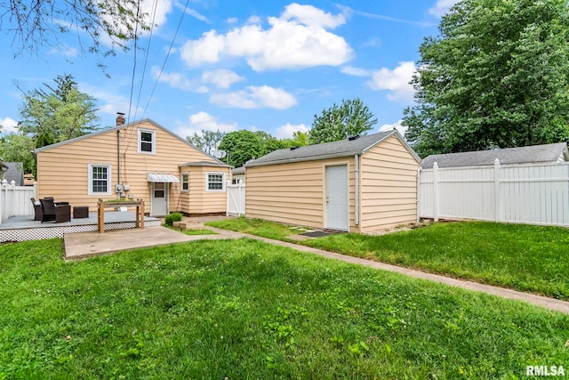 1622 W Cook St, Springfield, IL 62704 - back of house featuring an outdoor hangout area, an outdoor structure, and a patio