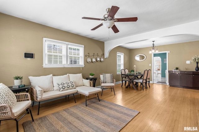 1622 W Cook St, Springfield, IL 62704 - living room with arched walkways, light wood-type flooring, and ceiling fan