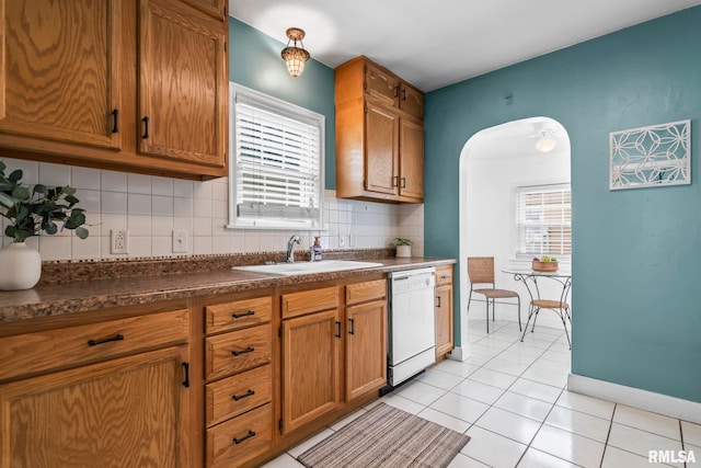 1622 W Cook St, Springfield, IL 62704 - kitchen with dishwasher, a sink, dark countertops, and decorative backsplash