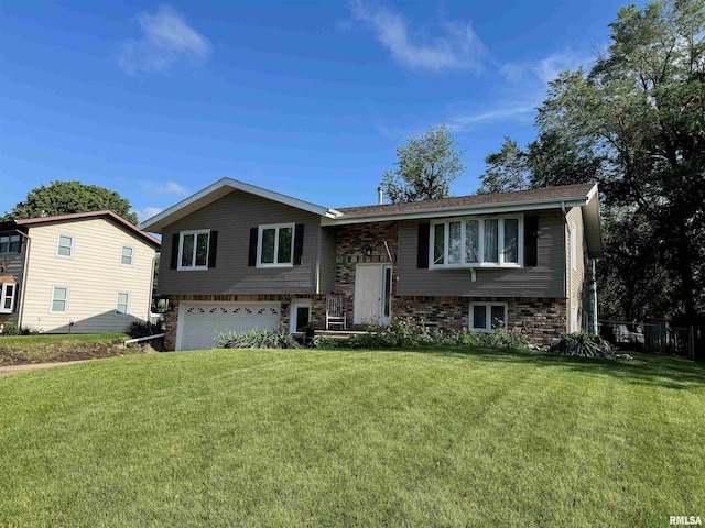 1666 Outrigger Rd, Galesburg, IL 61401 - split foyer home featuring a garage, a front yard, and brick siding