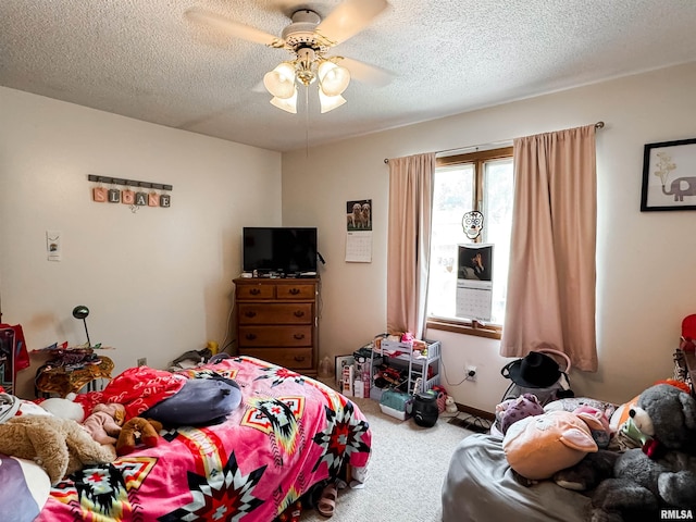 1666 Outrigger Rd, Galesburg, IL 61401 - carpeted bedroom with a textured ceiling and ceiling fan