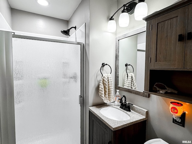 1666 Outrigger Rd, Galesburg, IL 61401 - bathroom featuring a shower stall, vanity, and toilet