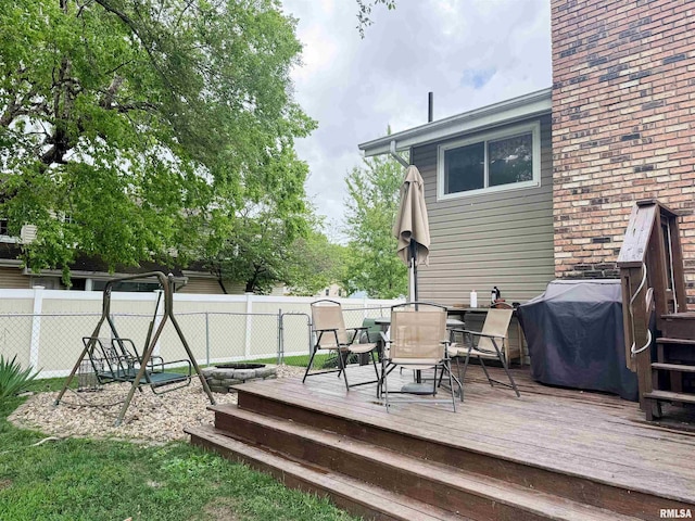 1666 Outrigger Rd, Galesburg, IL 61401 - deck featuring a fenced backyard, outdoor dining space, and area for grilling